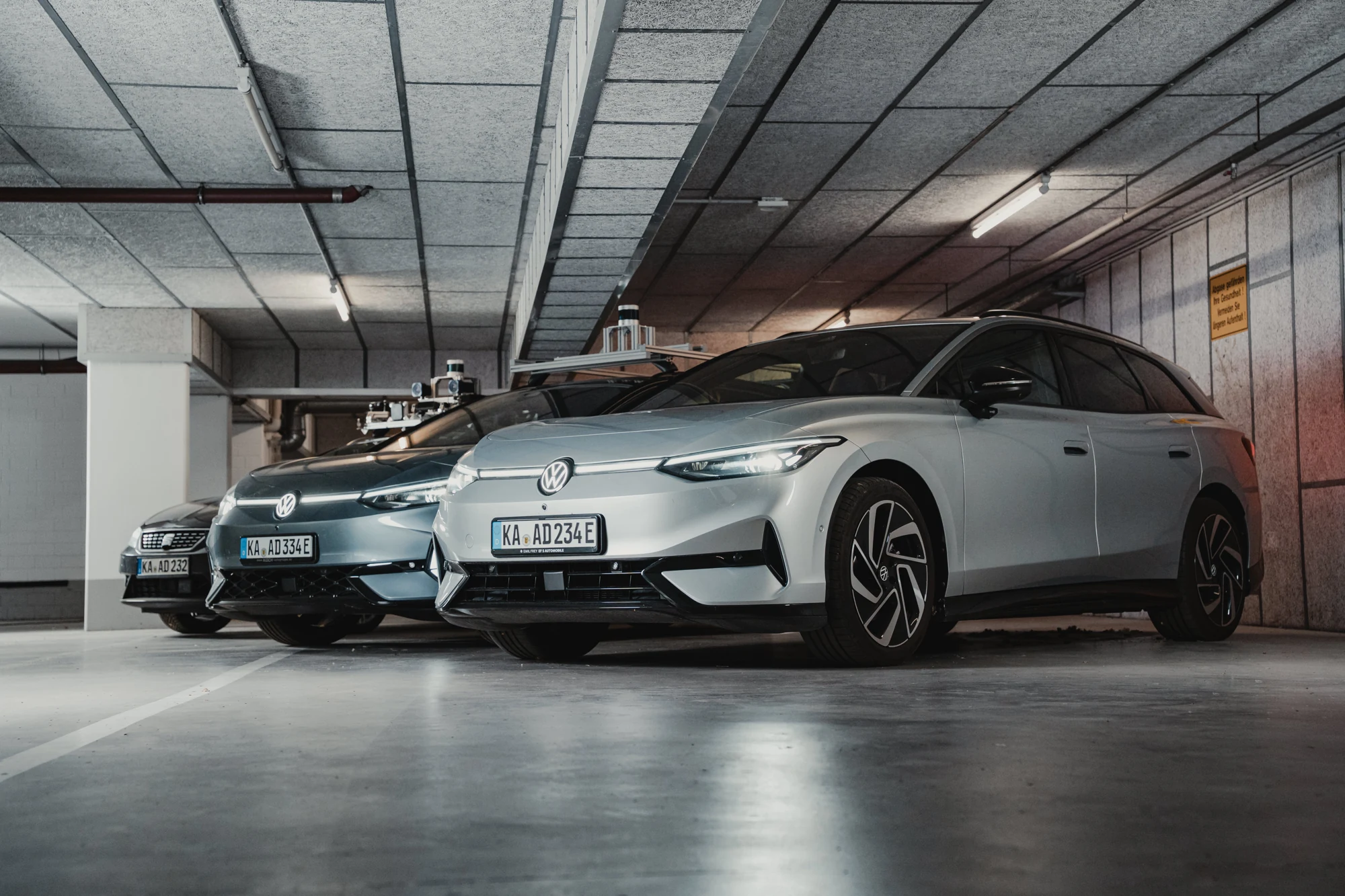SafeAD development vehicles in a garage, used for autonomy software integration, testing and validation.